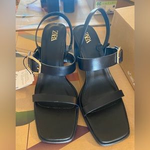 Black leather buckled heel sandal